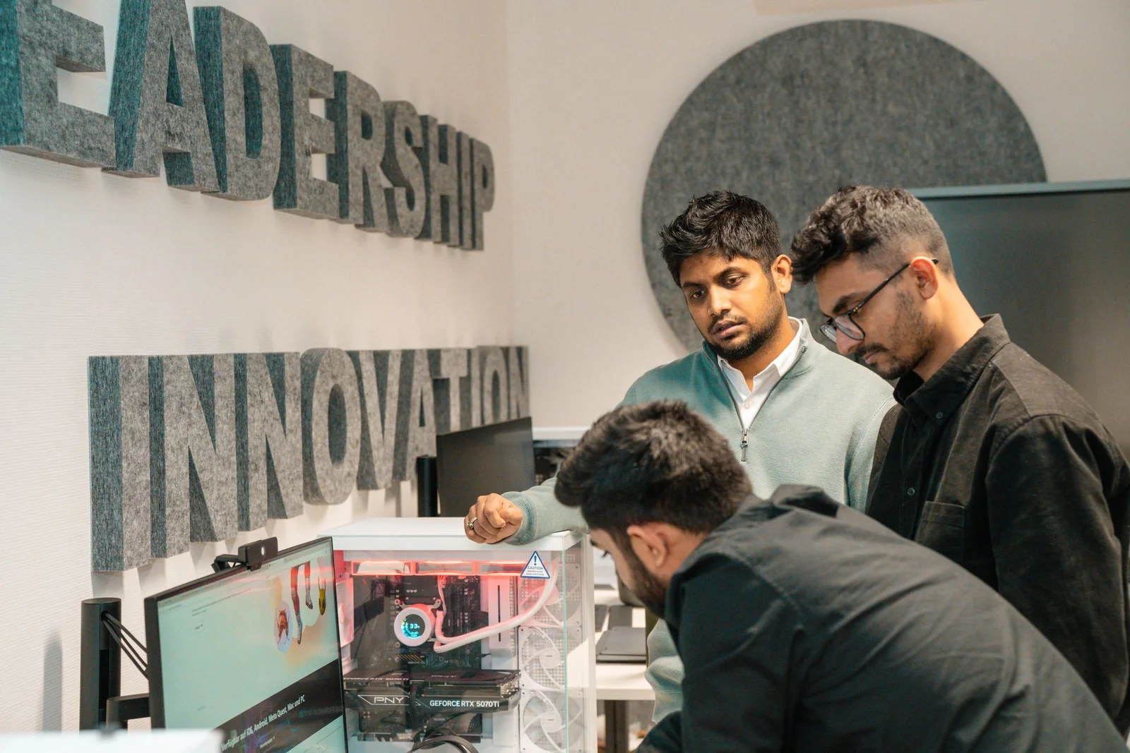 Technology team discussing an AI-assisted workflow and its controls.