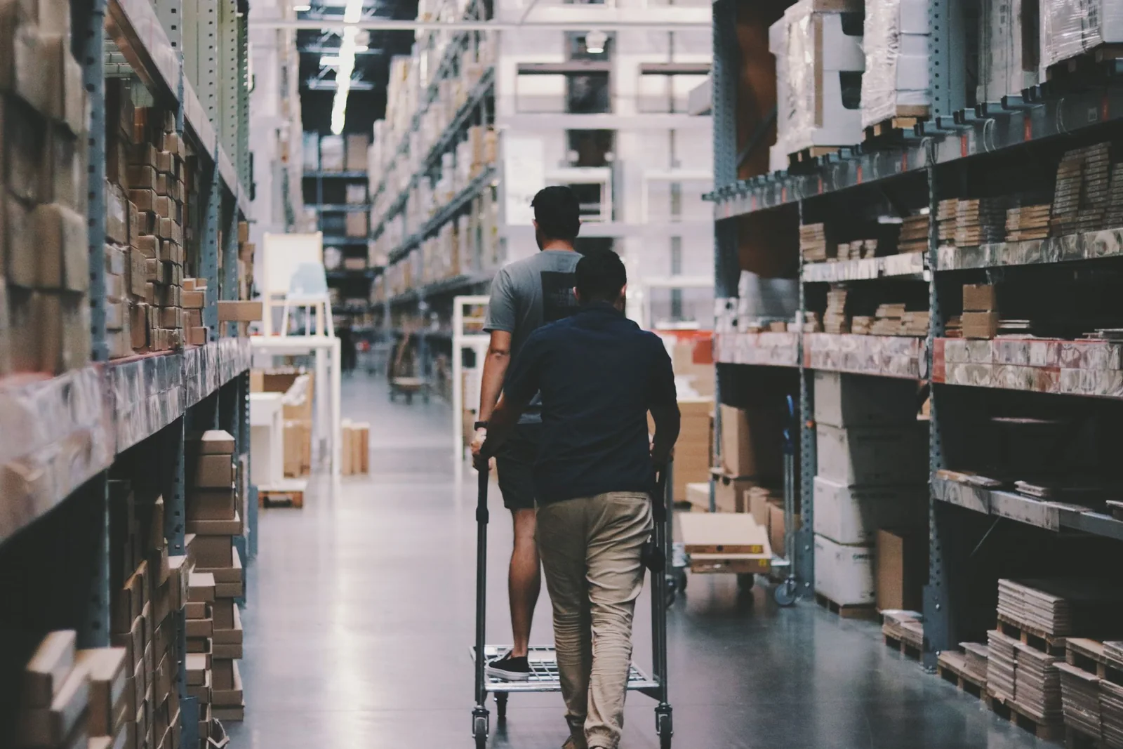 Procurement professionals reviewing warehouse operations.