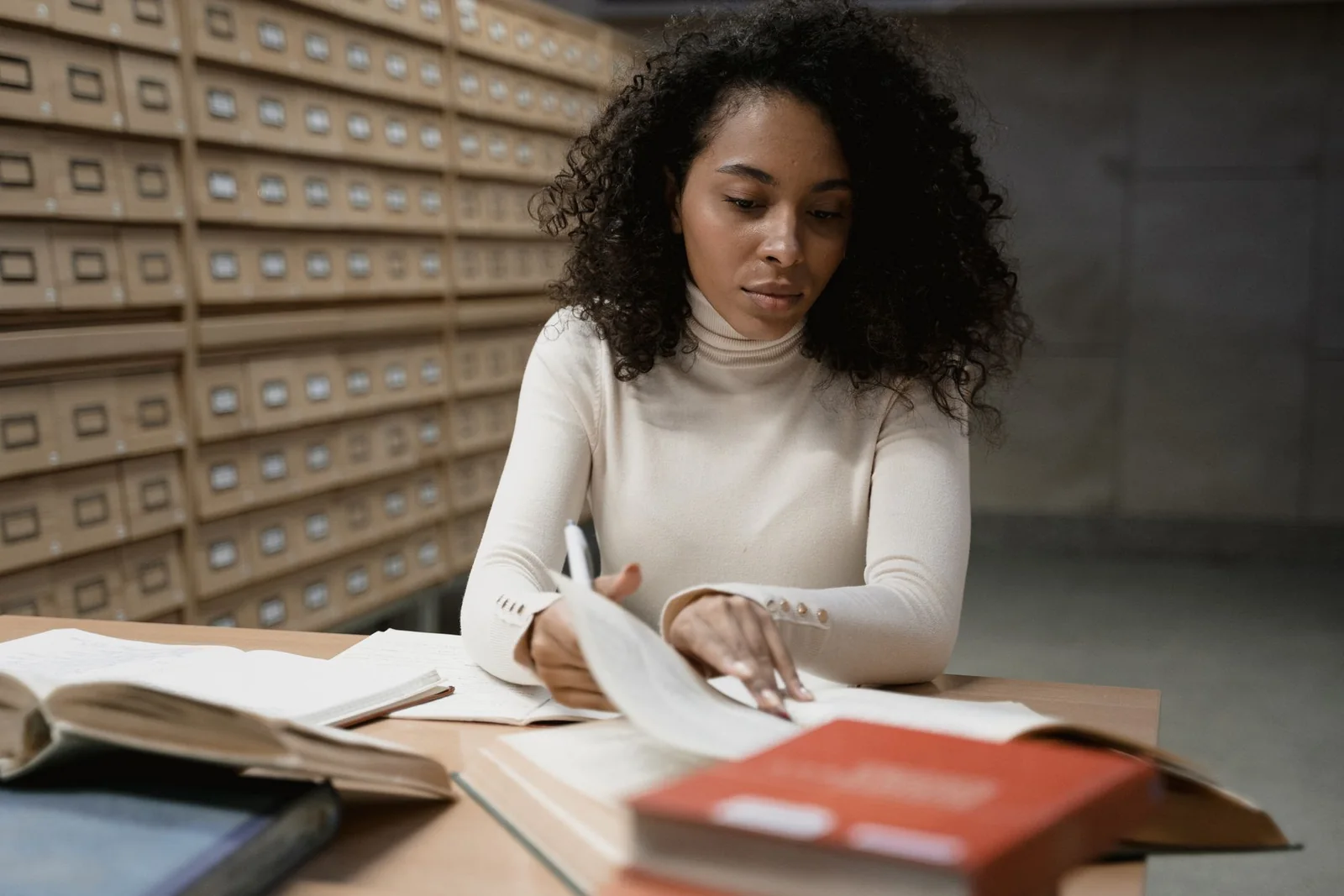 Adult learner preparing evidence for a professional-development assessment.