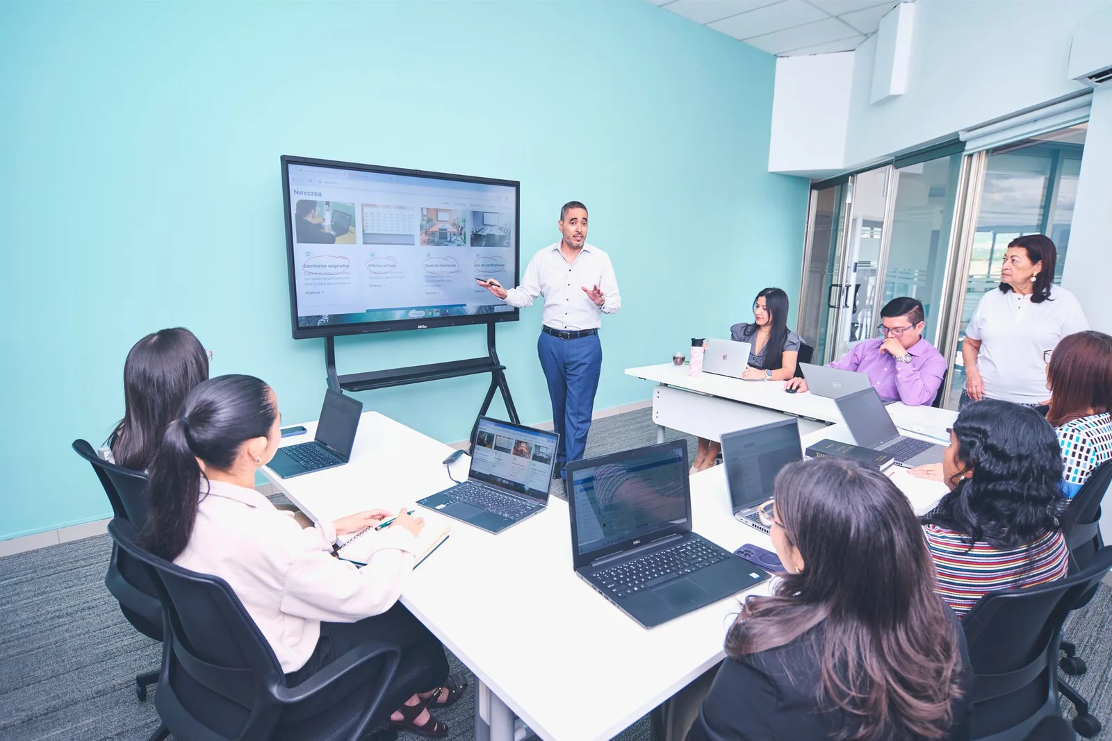 Business team testing a venture plan during a modern office presentation.