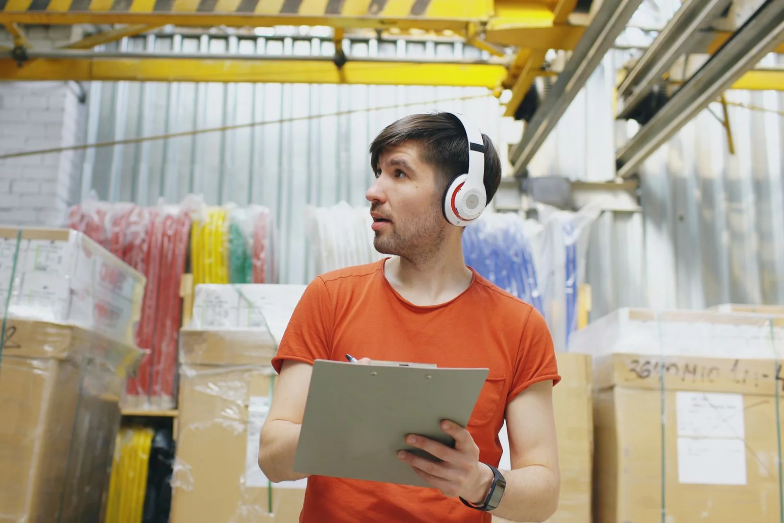 Warehouse professional verifying inventory information for a purchasing workflow.