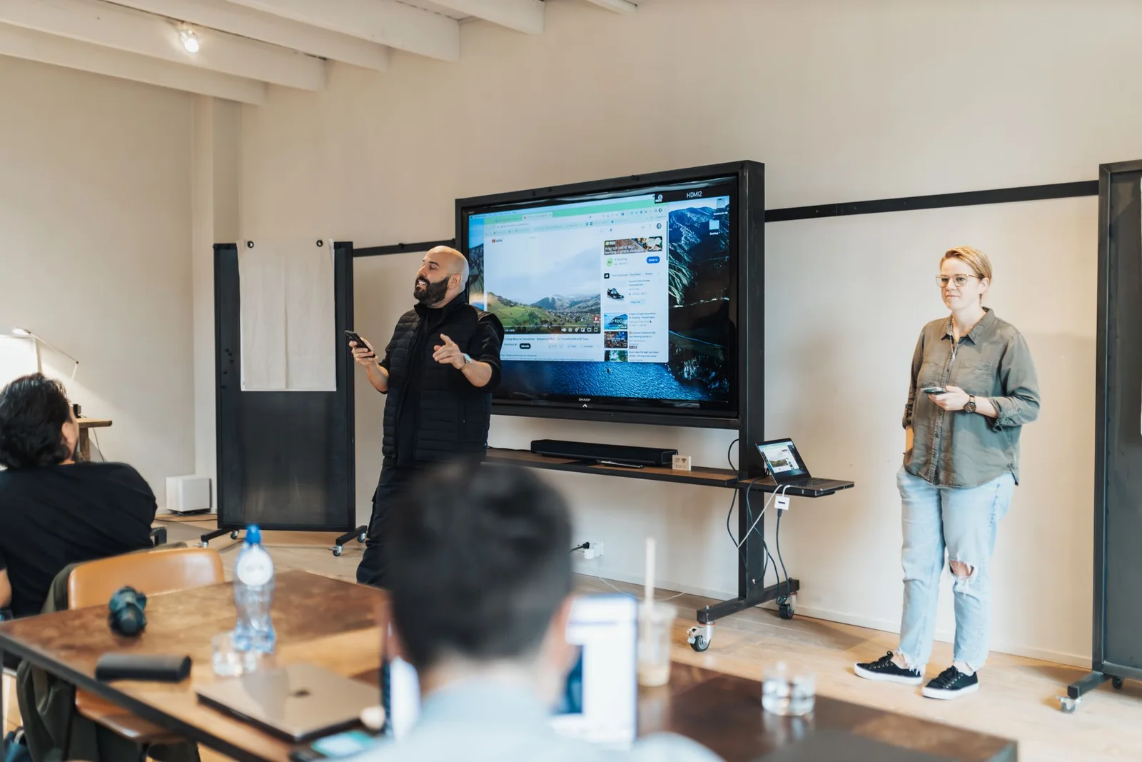 Professionals presenting and reviewing a coordinated business proposal.