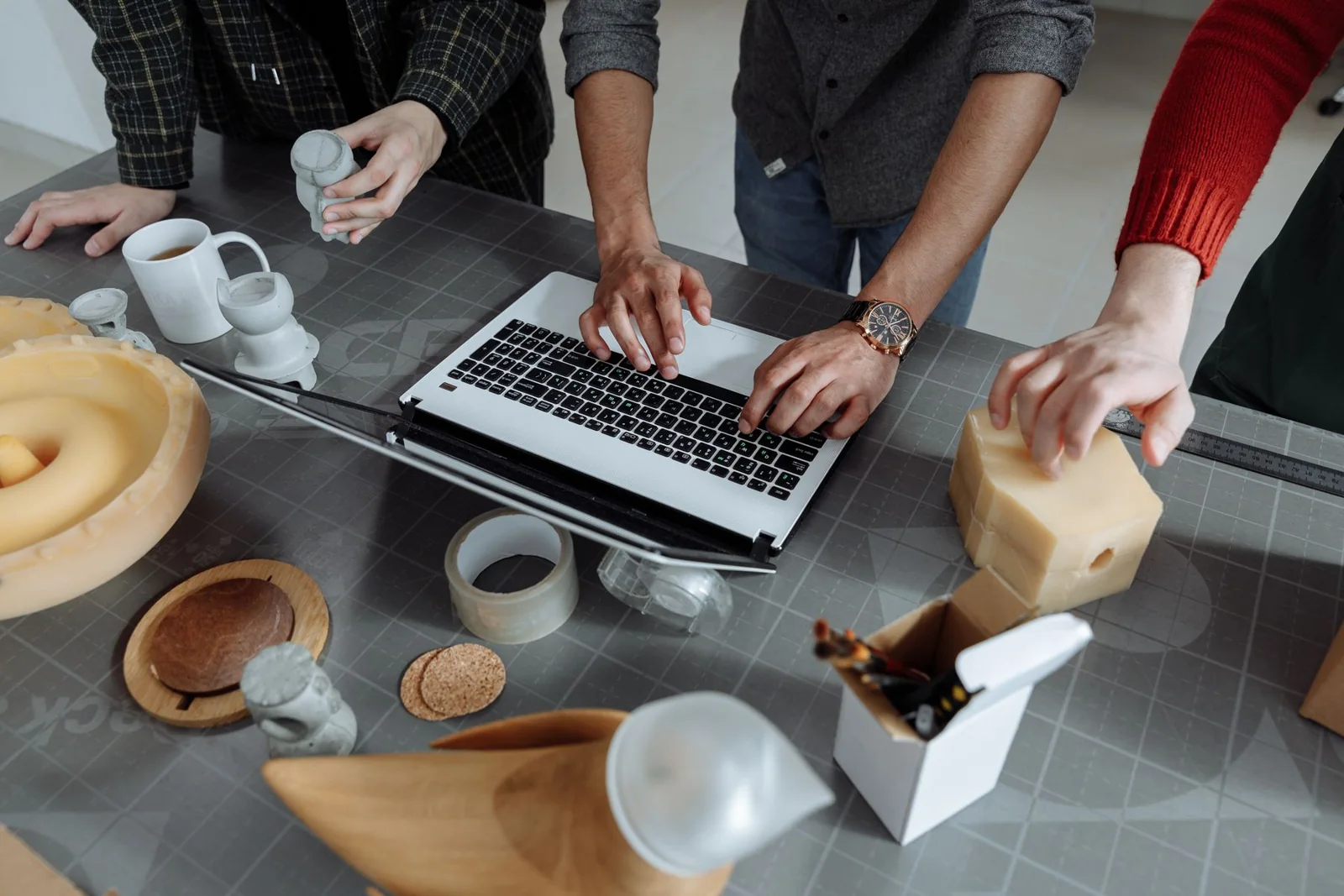 Engineers collaborating in a workshop during product development