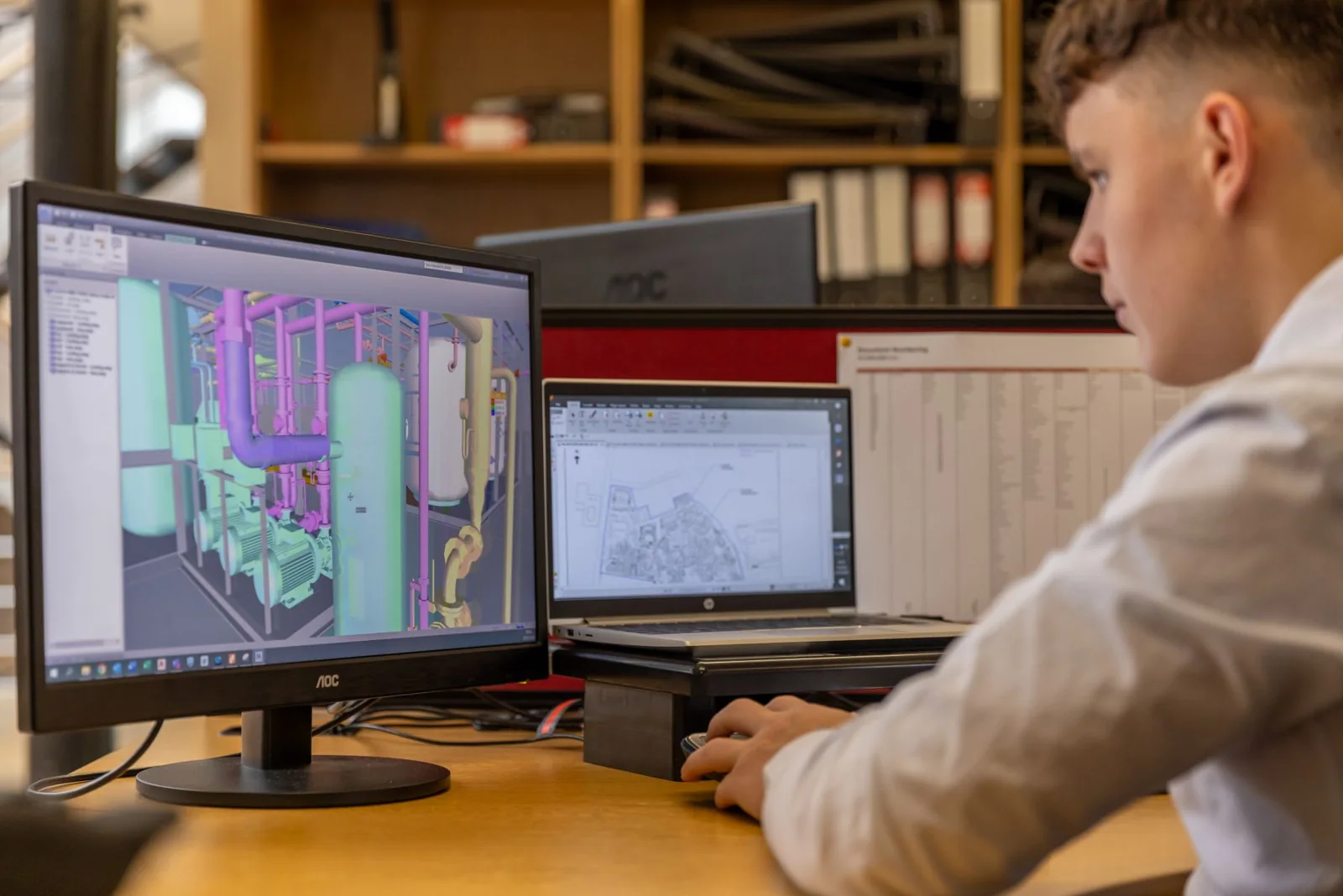 Engineer developing a product model in CAD software