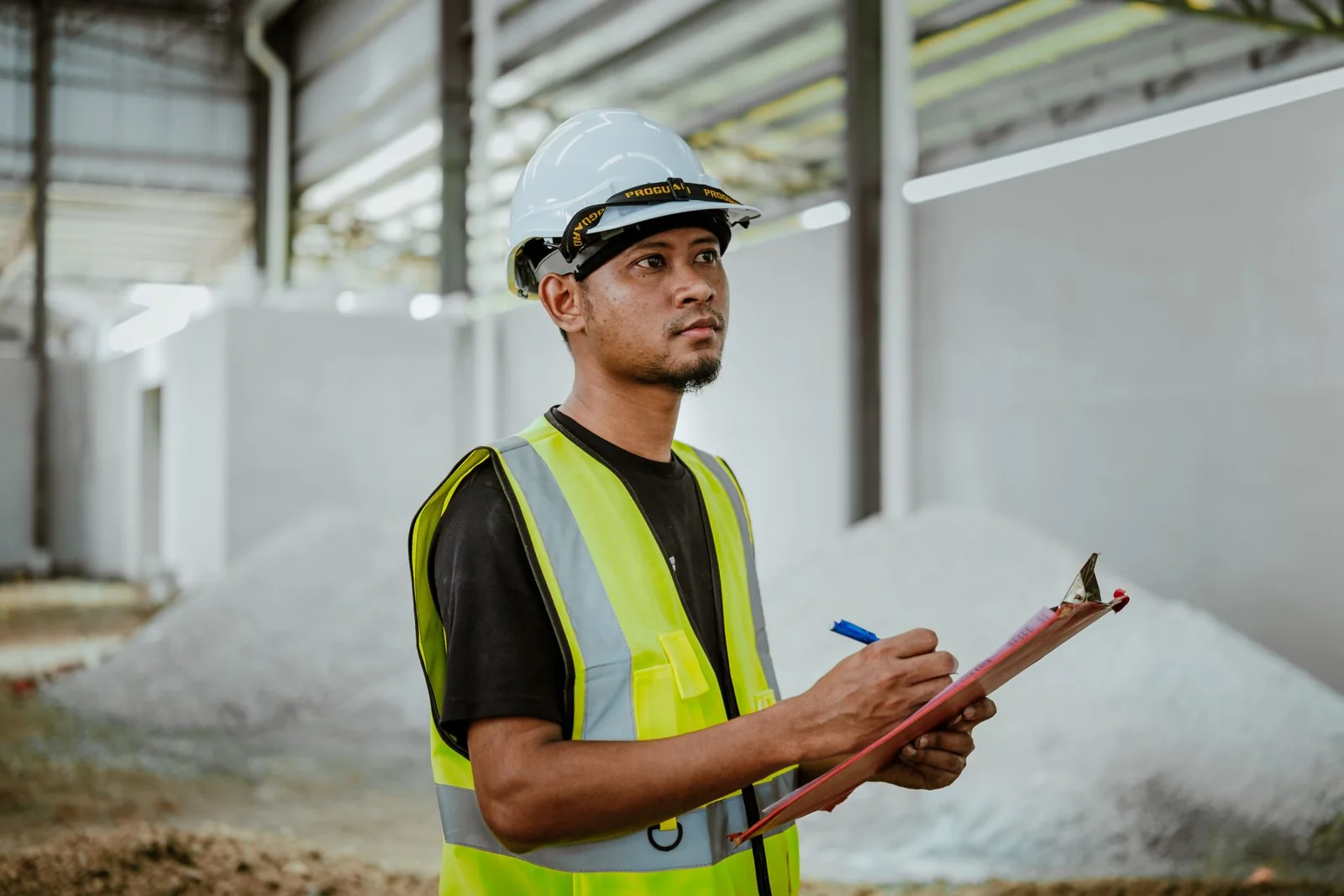 Factory professional conducting a documented equipment and quality inspection