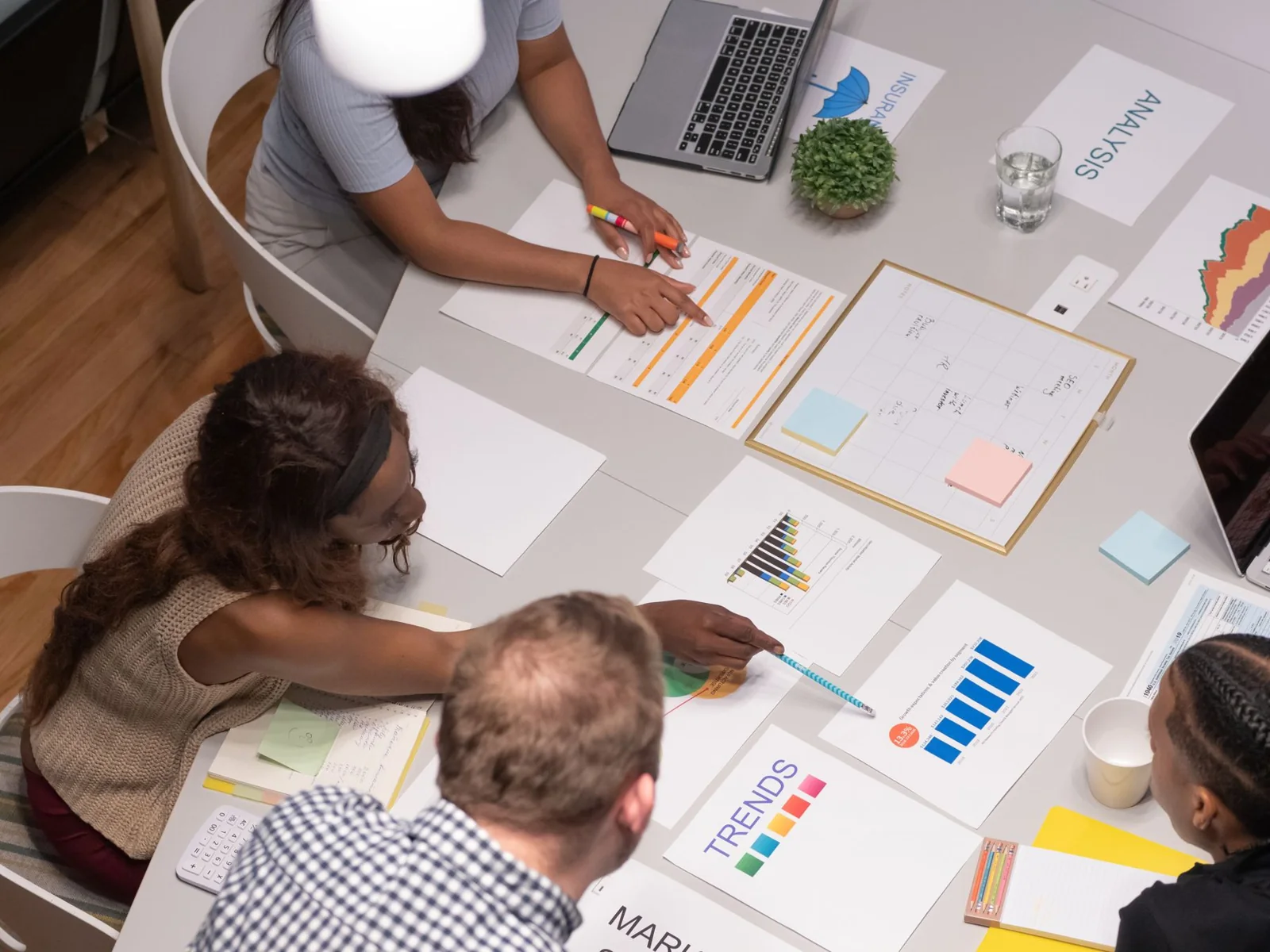 Business professionals analyzing charts and evidence during a validation workshop